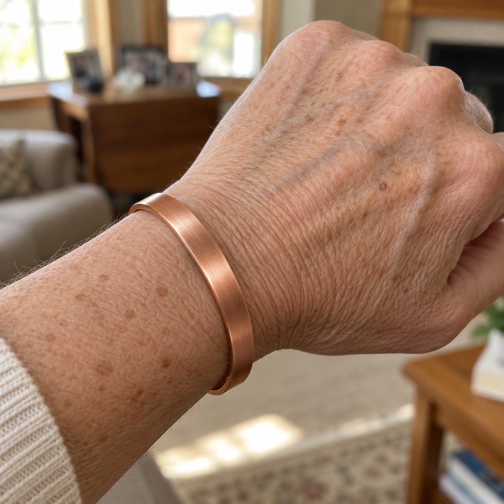 The Norvyn solid copper cuff worn on a woman's wrist